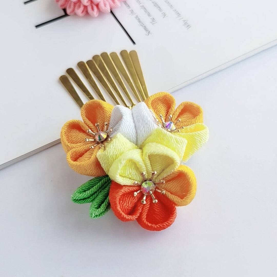 Gold comb hairpin with yellow, orange, and white cherry blossoms, part of the Sakura 4-piece kimono set.