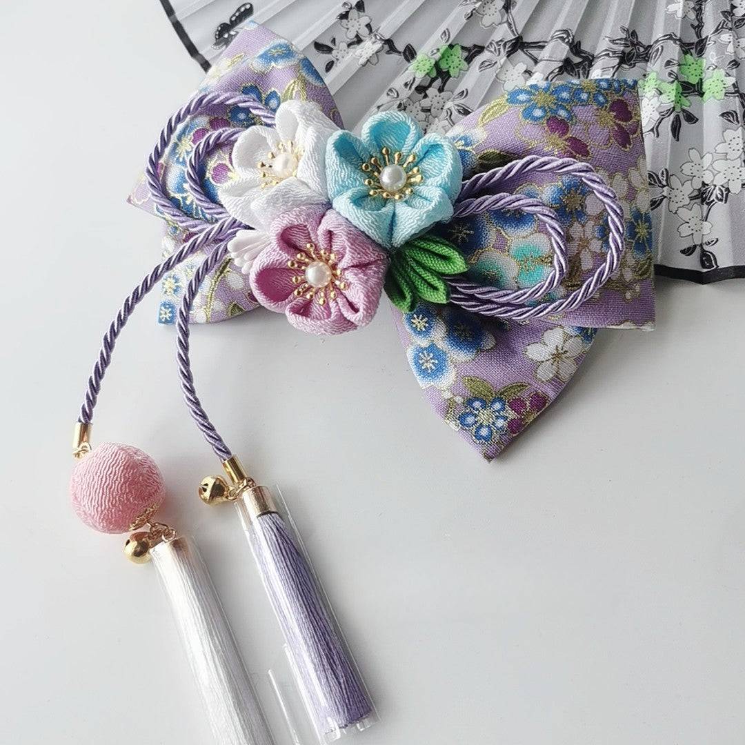 Purple floral Japanese kimono hair accessory with pastel cherry blossoms and pearl tassels for lolita styling.