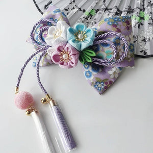 Purple floral Japanese kimono hair accessory with pastel cherry blossoms and pearl tassels for lolita styling.