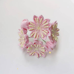 Top view of pink cherry blossom hairpin with five flowers arranged in a circular pattern, ideal for kimono styling.