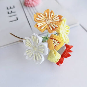 Side view of multicolor cherry blossom hairpin with yellow and orange petals, perfect for traditional Japanese outfits.