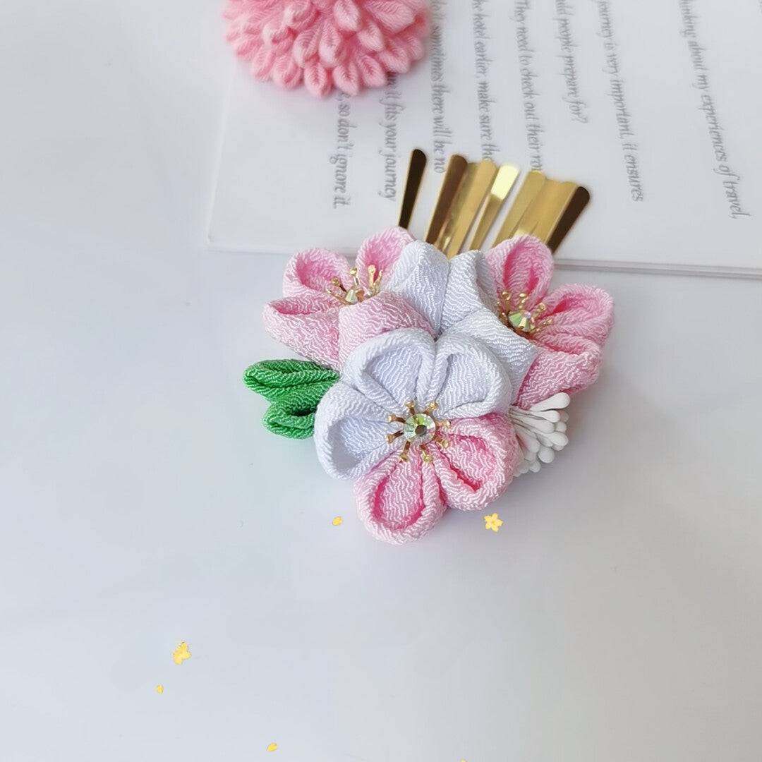Back view of comb-style cherry blossom hairpin with white and pink flowers, perfect for traditional Japanese wear.