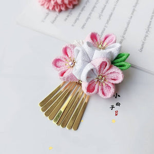 Gold comb-style hairpin adorned with pink and white cherry blossoms, from the Sakura fine work 4-piece set.