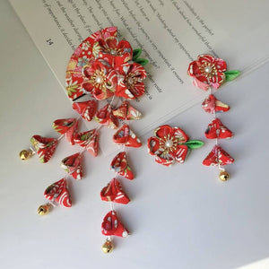 Red Japanese kimono hairpin set with intricate five-petal flowers, fan motif, and gold bell tassels for traditional outfits.