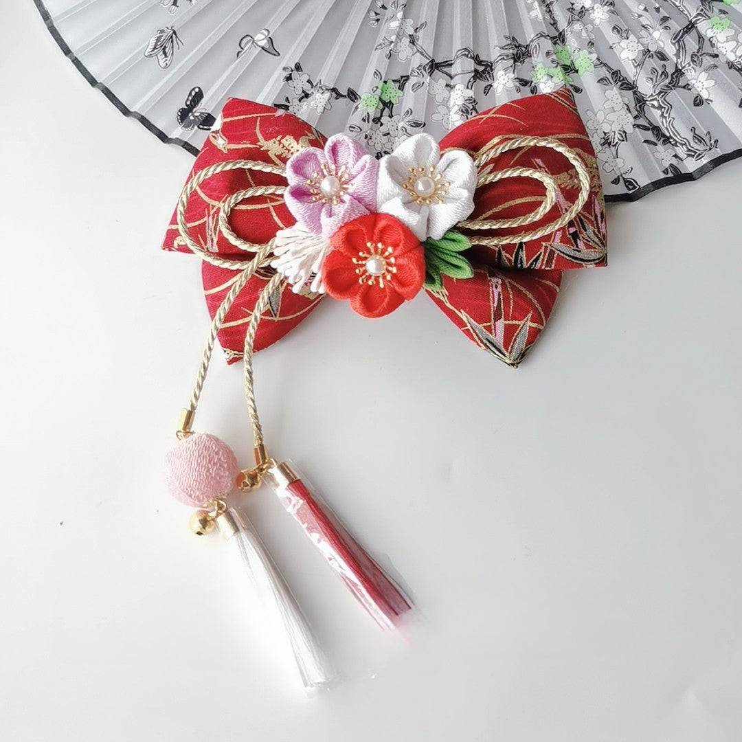 Burgundy kimono hairpin with purple, red, and white cherry blossom flowers, gold rope bow, and elegant hanging tassels.