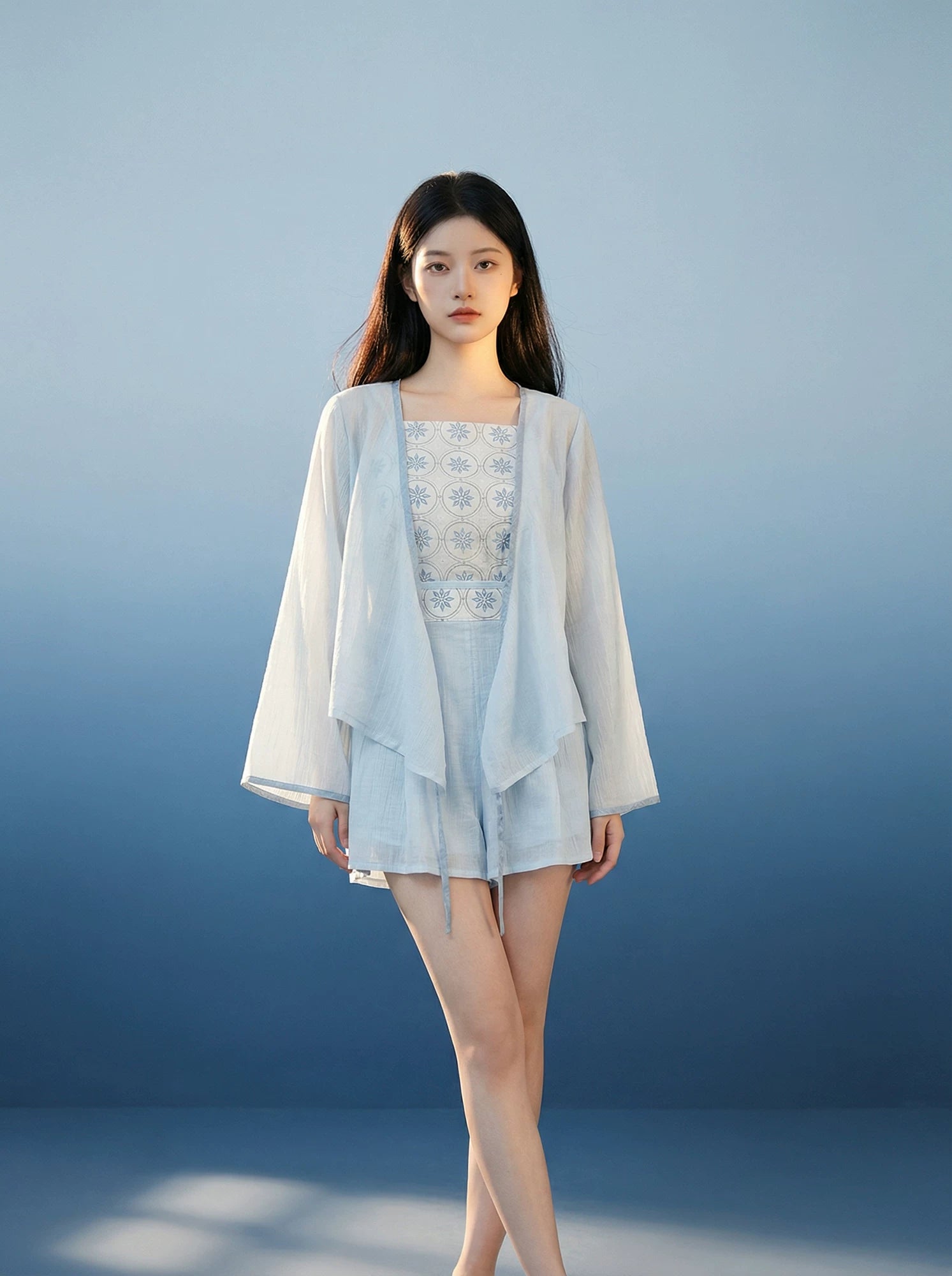 Comfortable xiaolu water suspender commuter set tencel cross neck top and bud shorts with sunscreen long sleeve cover up in blue standing front