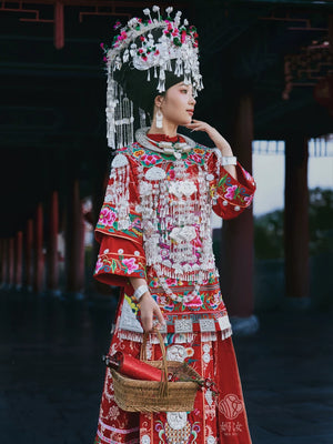 Heirloom quality authentic miao minority wedding gown vibrant red brocade traditional bridal dress standing front