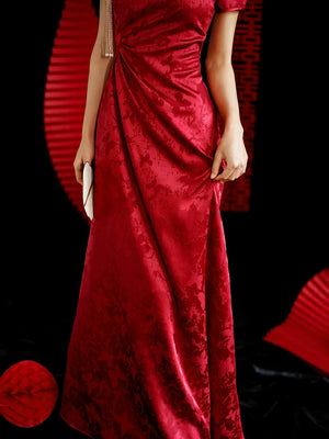Close-up of Red Kite Butterfly cheongsam bridal toast dress detail, traditional backdrop