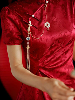 Close-up of red jacquard cheongsam dress collar with decorative tassels