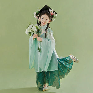 Playful pose in Green girls Hanfu 2025 children's ancient clothing Chinese style supe with floral crown and bouquet, styled for graduation photoshoot.