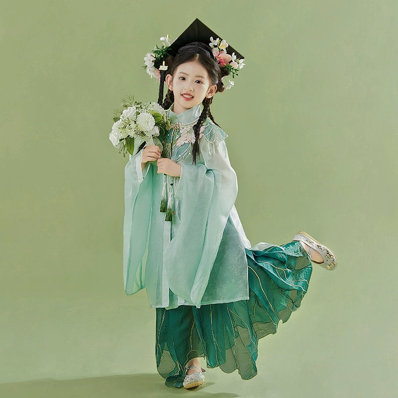 Playful pose in Green girls Hanfu 2025 children's ancient clothing Chinese style supe with floral crown and bouquet, styled for graduation photoshoot.
