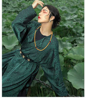 Elevate your style with our Tang Dynasty-inspired Round Collar Robe Hanfu. Crafted with attention to detail, this modern interpretation features a stylish round collar and half-arm design, perfect for men and women alike. Explore the timeless charm of ancient Chinese fashion with our green Hanfu ensemble.