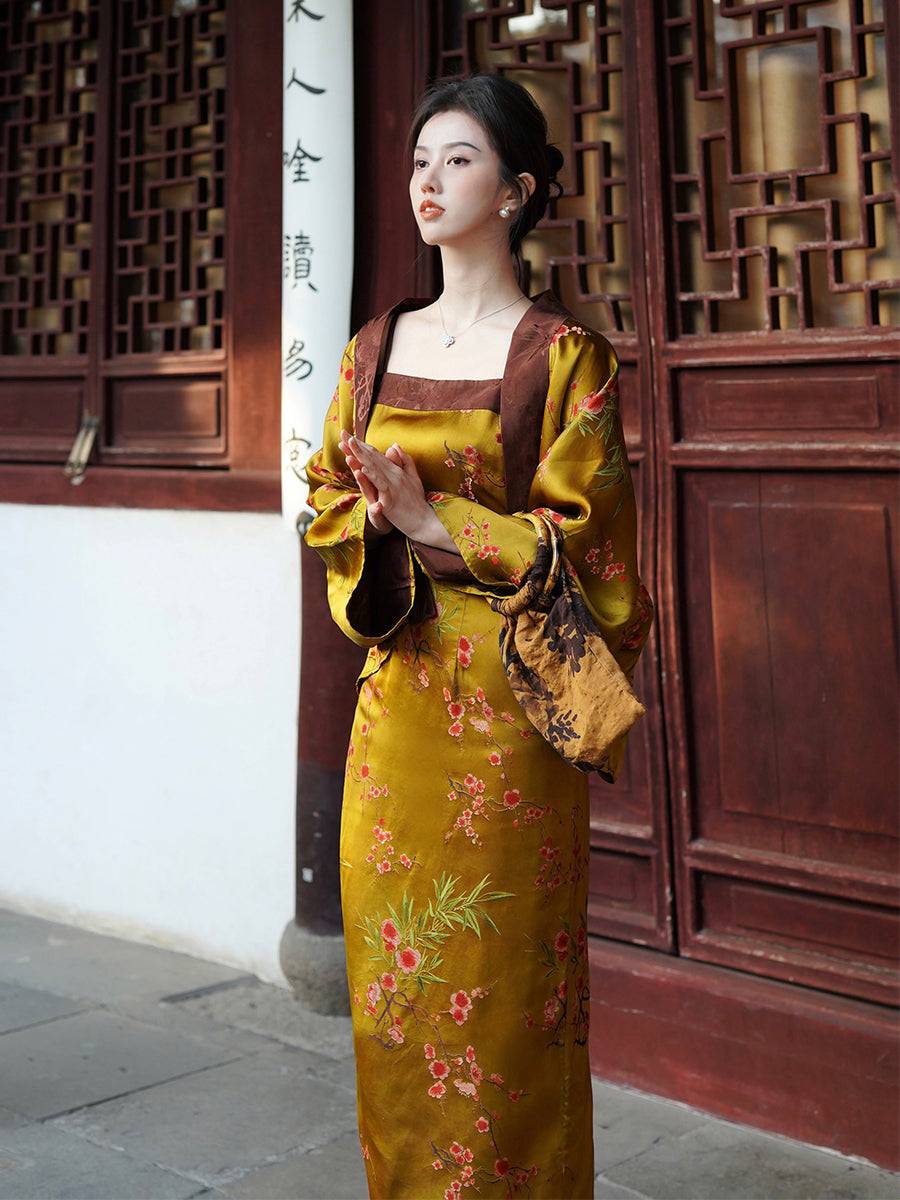 Elegant women's Golden Jelly Jacquard Dress Set with square neckline and floral patterns, displayed in front of traditional Chinese architecture.