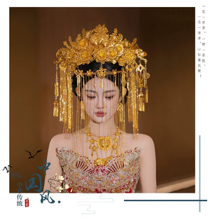 Front view of Chinese bride in ornate golden curtain headdress with floral details, ideal for traditional wedding ceremonies.