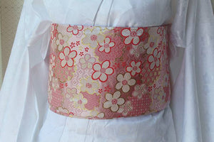 Front view of pink floral brocade kimono waist seal styled on white kimono. 120cm reversible cotton canvas with gold detailing.