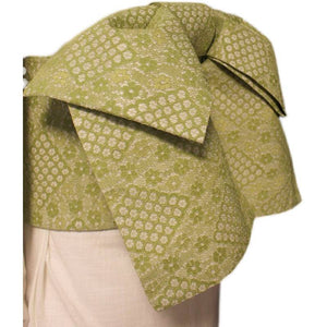 Close-up of high-grade green lace kimono waist seal bow, highlighting detailed floral and geometric lace patterns.