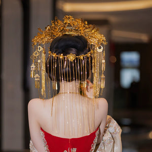Back view of golden bridal headdress with cascading chains and floral motifs, designed for Chinese wedding hair accessories.