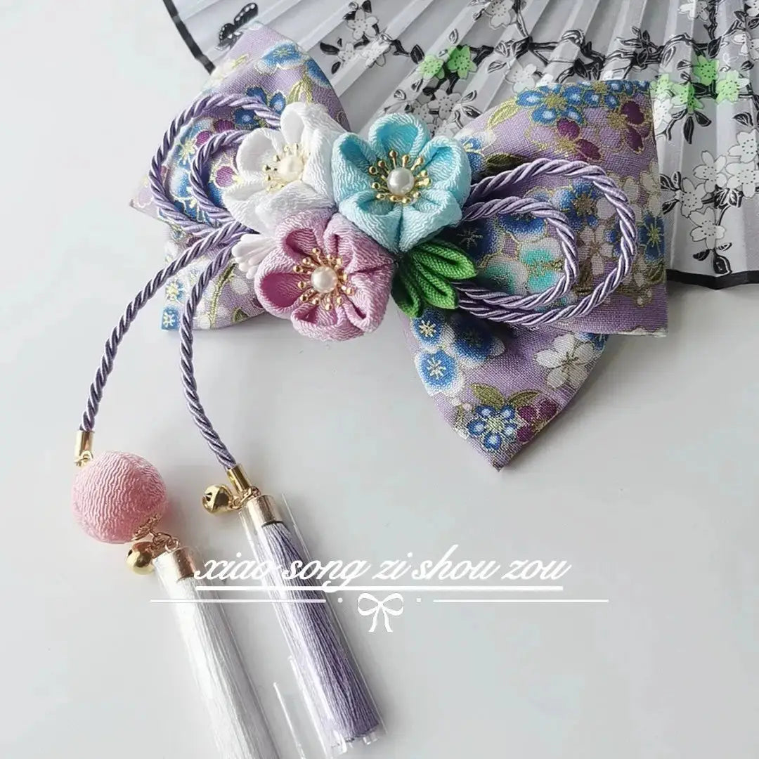 Lavender floral Japanese kimono hair accessory with pastel blossoms and purple tassels, perfect for lolita or hanfu outfits.