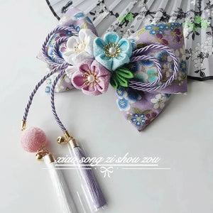 Lavender floral Japanese kimono hair accessory with pastel blossoms and purple tassels, perfect for lolita or hanfu outfits.