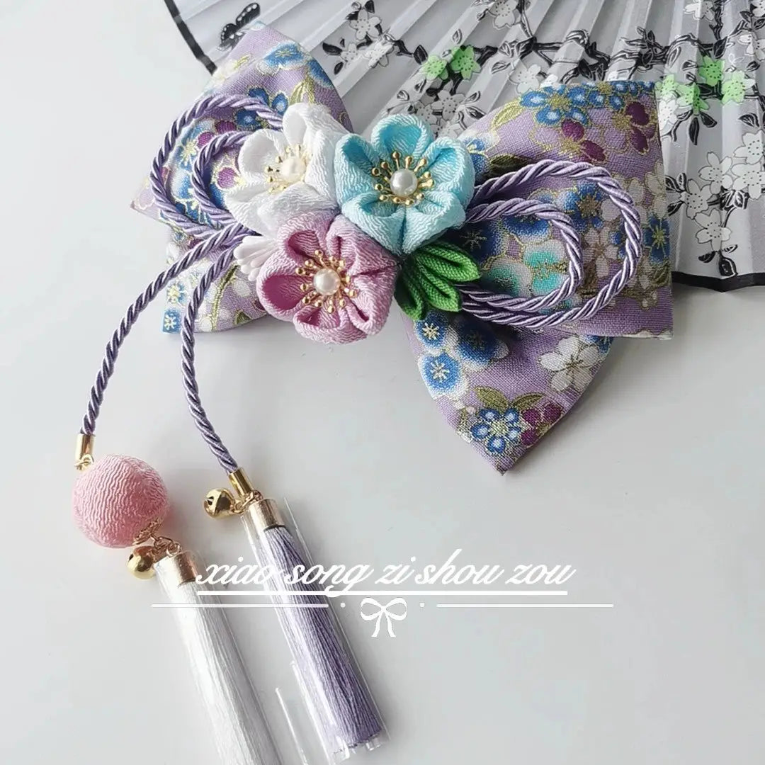 Purple floral Japanese kimono hair accessory with pastel cherry blossoms and pearl tassels for lolita styling.