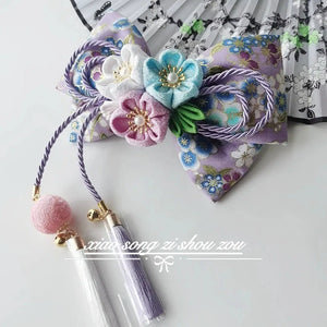 Purple floral Japanese kimono hair accessory with pastel cherry blossoms and pearl tassels for lolita styling.