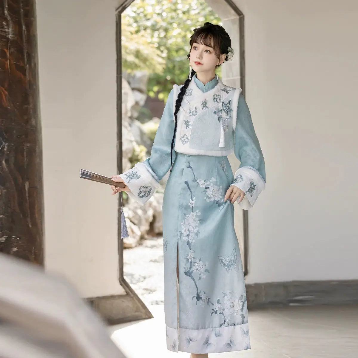 High-quality women's cheongsam with a pear blossom embroidery design. A fashionable and warm choice for autumn and winter workwear.