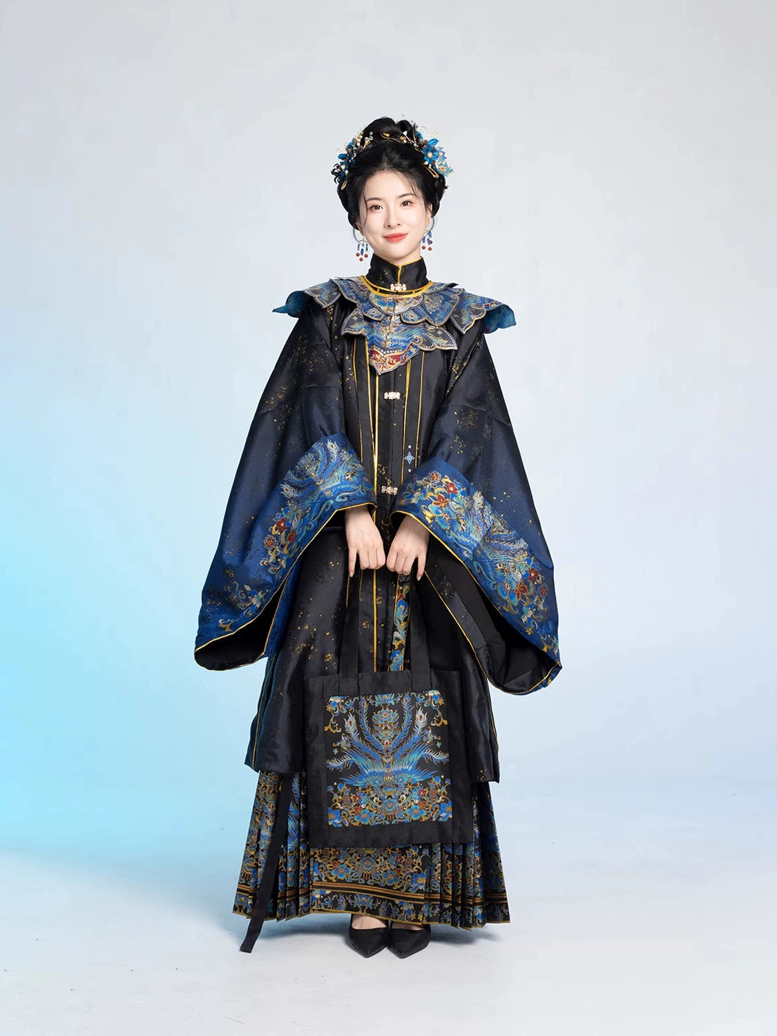 Full-length view of 2025 Chinese style graduation Hanfu set in black and blue with embroidered phoenix motifs and traditional accessories.