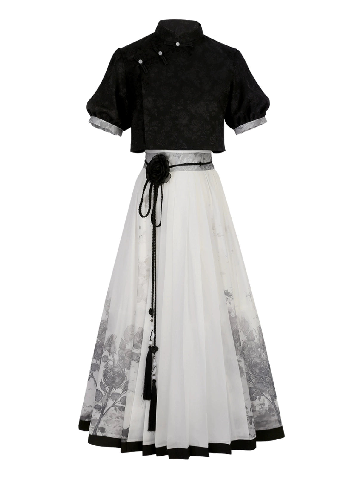 Flat lay of New Chinese style black top and floral print skirt set, showcasing modern Hanfu design for spring and summer.