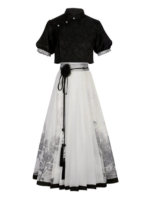 Flat lay of New Chinese style black top and floral print skirt set, showcasing modern Hanfu design for spring and summer.