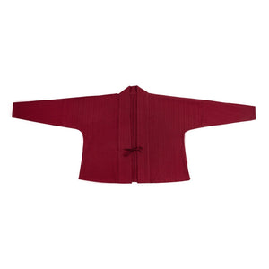 Flat-lay of green pleated Hanfu skirt with bamboo pattern, ideal for pairing with traditional Hanfu coats for a winter look.