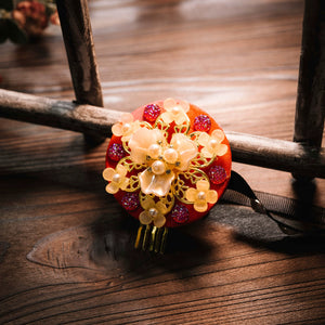 Orange Korean ethnic headgear with pink floral accents and pearl centerpiece, ideal for traditional Korean hairstyles.