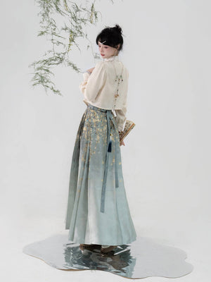 Back view of Ming-dynasty inspired Hanfu skirt with silk jasmine motif and flowing pleats, paired with a vintage cream top.
