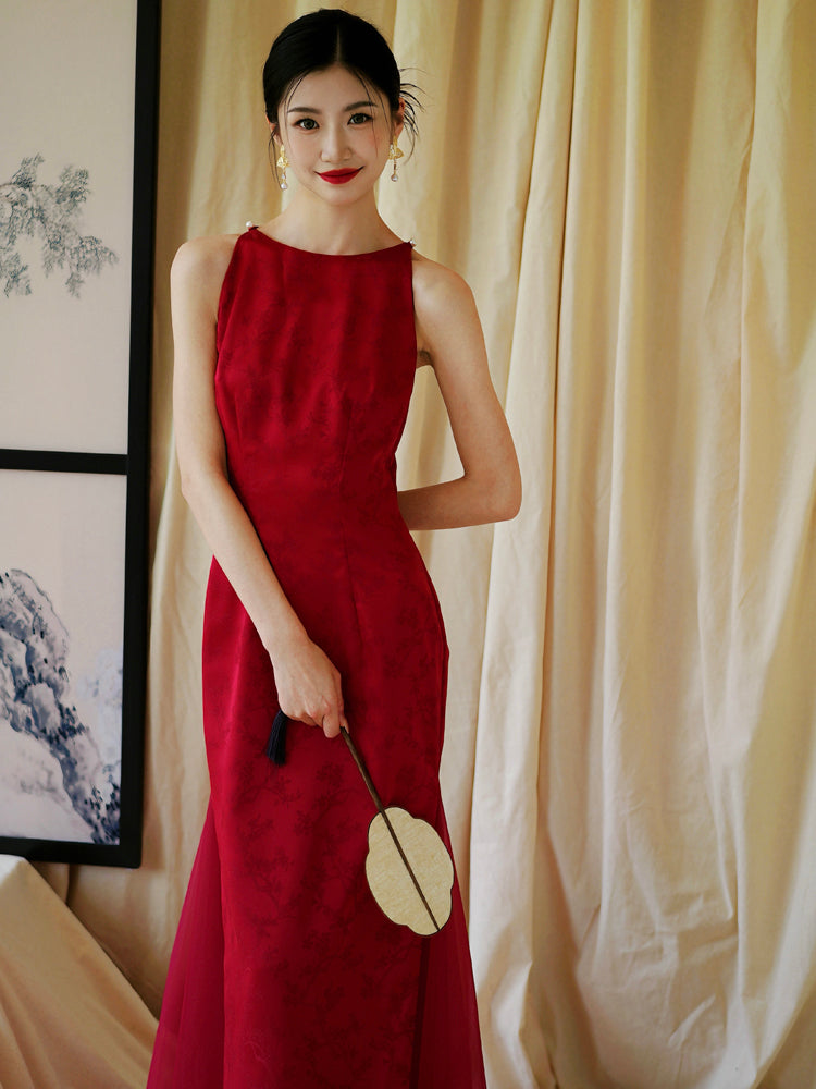 Bride playfully holding fan over face in red cheongsam dress, ideal for wedding or engagement occasions.