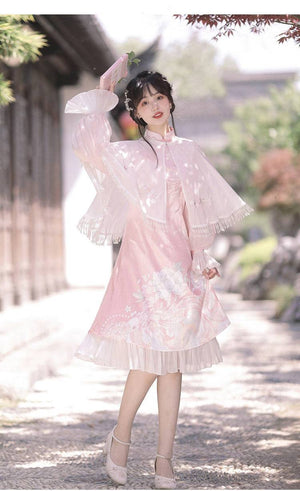Feihua Hanfu Cheongsam Dress in pink with floral design and cape, styled with heels and floral hair accessories for a festive look.