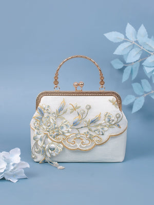 White Yuejian embroidered cheongsam Hanfu bag featuring delicate floral patterns, gold accents, and a vintage clasp design.