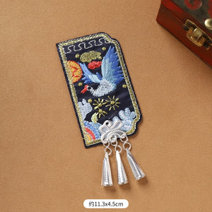 Blue bird embroidered Guizhou Miao fridge magnet with silver cone fringe, 11.3x4.5cm, handmade ethnic kitchen ornament.