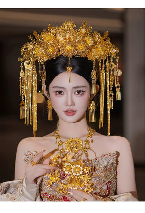Front-facing bride in ornate golden headdress with floral and tassel accents, ideal for Chinese bridal hair accessories.