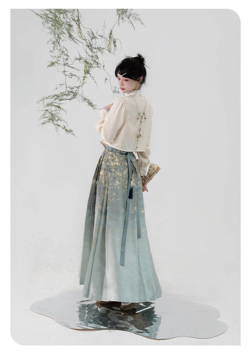 Rear view of traditional Hanfu skirt featuring silk jasmine embroidery and long ribbon ties, paired with a sheer cream blouse.
