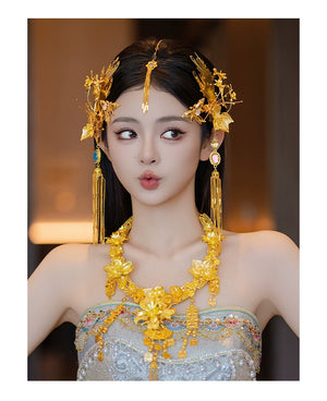 Playful bride modeling gold Chinese dragonfly hairpin and matching jewelry, ideal for cheongsam engagement styling.