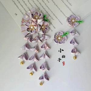 Lavender Japanese kimono hairpin set with five-petal flowers, fan motif, and gold bell tassels for elegant traditional styling.
