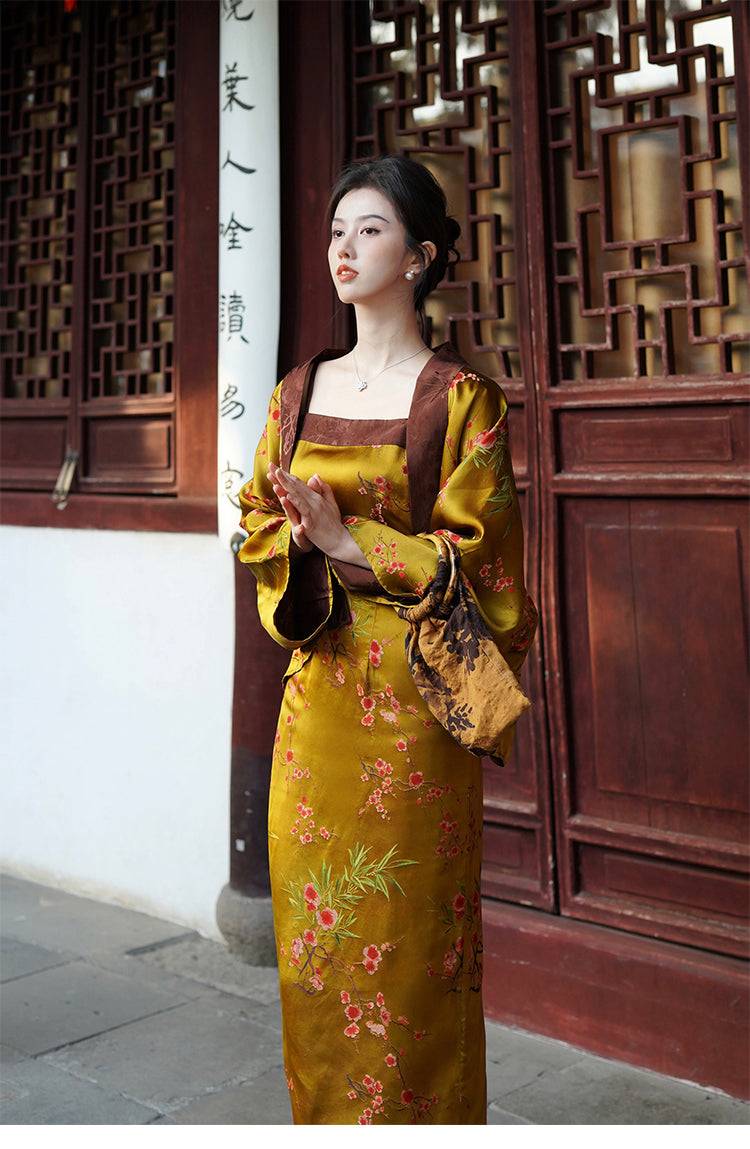 Elegant Golden Jelly Jacquard Dress Set with floral embroidery and fragrant cloud yarn, modeled in front of red wooden Chinese doors.