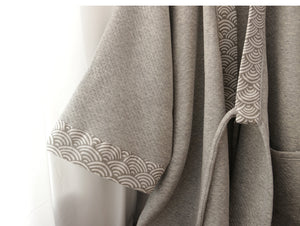 Sleeve detail of thickened gray Hanfu loungewear, featuring traditional wave-pattern trim and textured fabric.