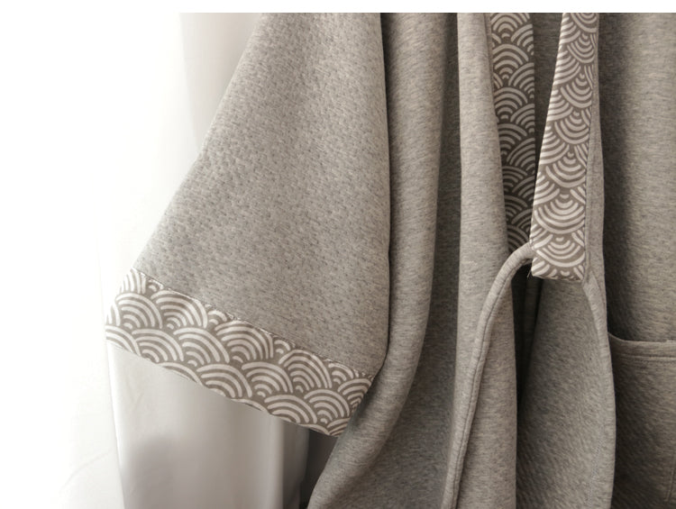 Sleeve detail of thickened gray Hanfu loungewear, featuring traditional wave-pattern trim and textured fabric.