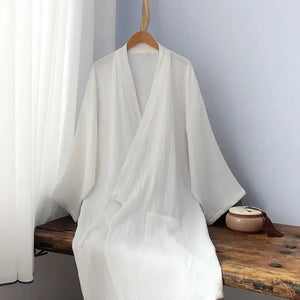 Chinese style pure white Hanfu robe on wooden bench, made from breathable cotton, perfect for homewear or pajamas.