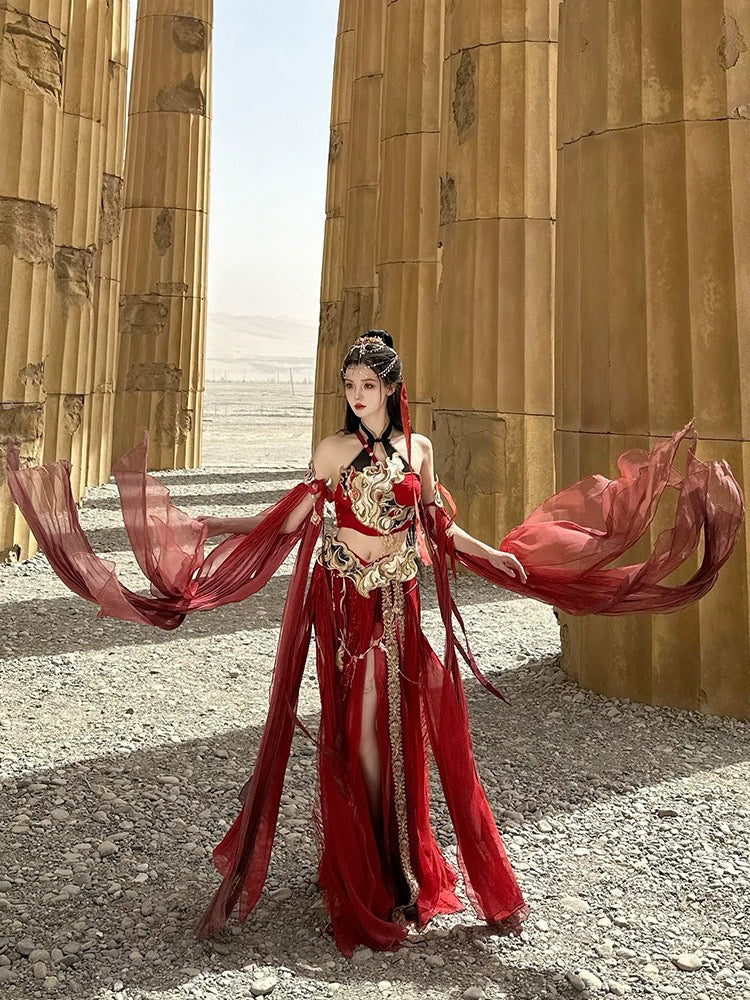 Flowing red Sacred Flame Western Regions Dancer Hanfu for women, styled with ornate gold details, modeled among desert temple pillars.