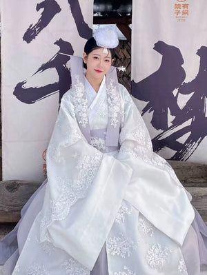 Traditional Korean White Yanji Hanbok court dress with floral embroidery, styled for cultural events or daily elegant wear.
