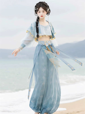 【Cloud Traveler】 Hanfu Princess Jasmine blue ethnic suit with flowing pants and gold accents, styled on a beach background.