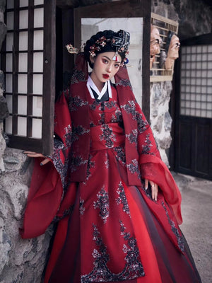 Yandan_Hanfu red traditional Korean palace-style wedding dress with black floral embroidery, ancient stone building