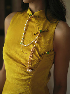 Detailed view of beaded fringe on yellow Cheongsam shawl, highlighting bridal accessory craftsmanship.