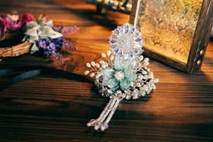 Korean traditional ethnic headgear with intricate crystal and pearl design, styled for Korean princess hair accessories on rustic background.